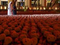 People visit the installation of teddy bears titled ''Echo of Lost Innocence'' at the Barahat Mashaireb open-air gallery to draw attention t...