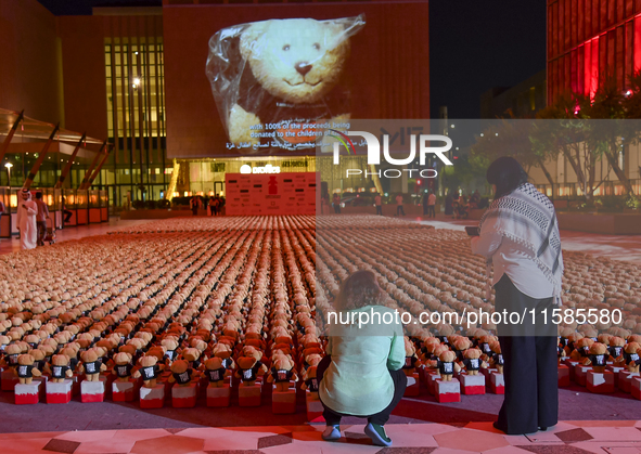 People visit the installation of teddy bears titled ''Echo of Lost Innocence'' at the Barahat Mashaireb open-air gallery to draw attention t...