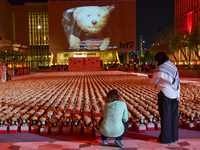 People visit the installation of teddy bears titled ''Echo of Lost Innocence'' at the Barahat Mashaireb open-air gallery to draw attention t...