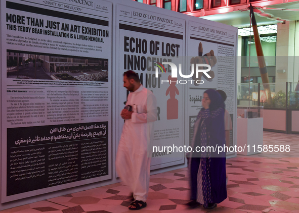 People visit the installation of teddy bears titled ''Echo of Lost Innocence'' at the Barahat Mashaireb open-air gallery to draw attention t...