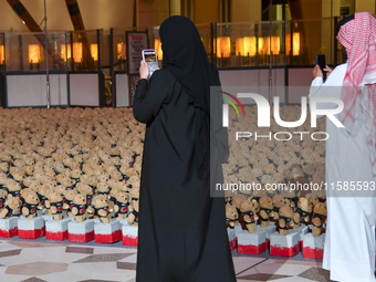 People visit the installation of teddy bears titled ''Echo of Lost Innocence'' at the Barahat Mashaireb open-air gallery to draw attention t...