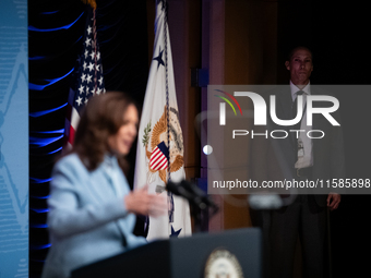 A Secret Service agent watches as Vice President and Democratic presidential nominee Kamala Harris delivers remarks at the annual conference...