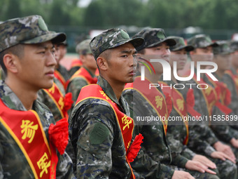 Young conscripts attend a send-off ceremony for new recruits in Fuyang, China, on September 19, 2024. (