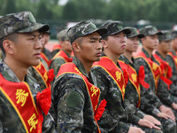 Young conscripts attend a send-off ceremony for new recruits in Fuyang, China, on September 19, 2024. (