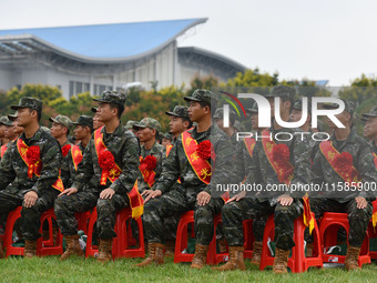 Young conscripts attend a send-off ceremony for new recruits in Fuyang, China, on September 19, 2024. (