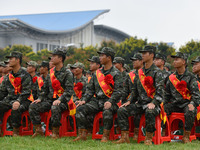 Young conscripts attend a send-off ceremony for new recruits in Fuyang, China, on September 19, 2024. (