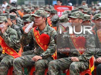 Young conscripts attend a send-off ceremony for new recruits in Fuyang, China, on September 19, 2024. (