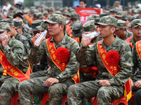 Young conscripts attend a send-off ceremony for new recruits in Fuyang, China, on September 19, 2024. (