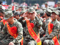 Young conscripts attend a send-off ceremony for new recruits in Fuyang, China, on September 19, 2024. (