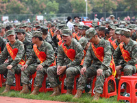 Young conscripts attend a send-off ceremony for new recruits in Fuyang, China, on September 19, 2024. (