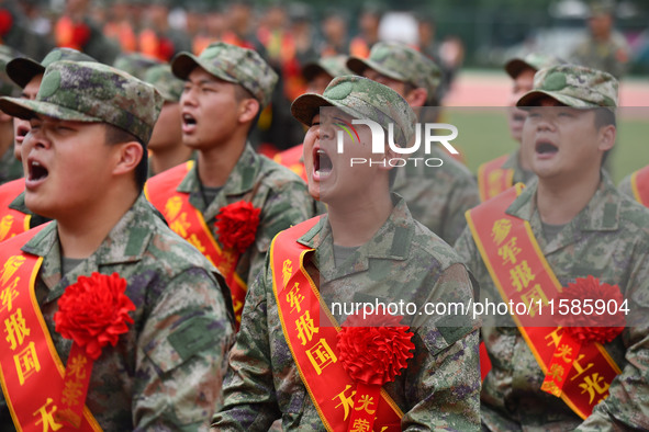 Young conscripts attend a send-off ceremony for new recruits in Fuyang, China, on September 19, 2024. 