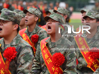 Young conscripts attend a send-off ceremony for new recruits in Fuyang, China, on September 19, 2024. (