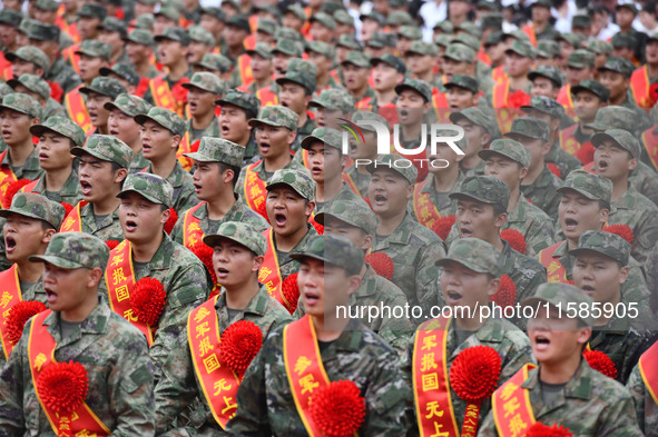 Young conscripts attend a send-off ceremony for new recruits in Fuyang, China, on September 19, 2024. 