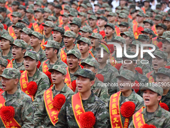 Young conscripts attend a send-off ceremony for new recruits in Fuyang, China, on September 19, 2024. (