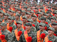 Young conscripts attend a send-off ceremony for new recruits in Fuyang, China, on September 19, 2024. (