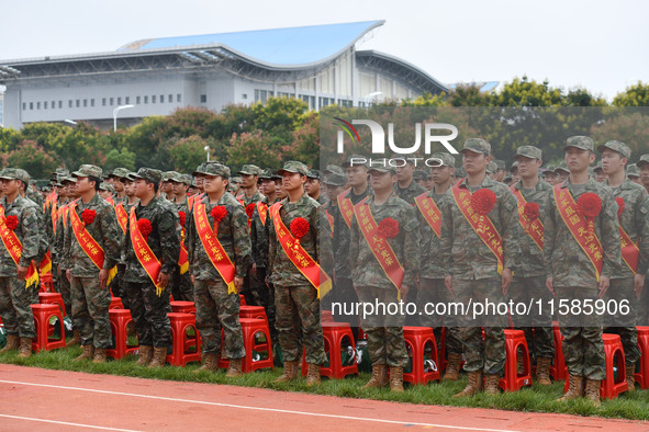 Young conscripts attend a send-off ceremony for new recruits in Fuyang, China, on September 19, 2024. 