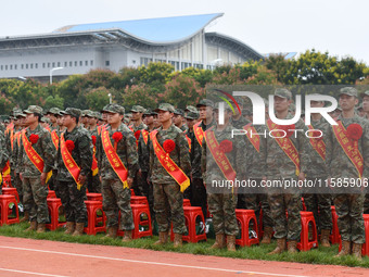 Young conscripts attend a send-off ceremony for new recruits in Fuyang, China, on September 19, 2024. (