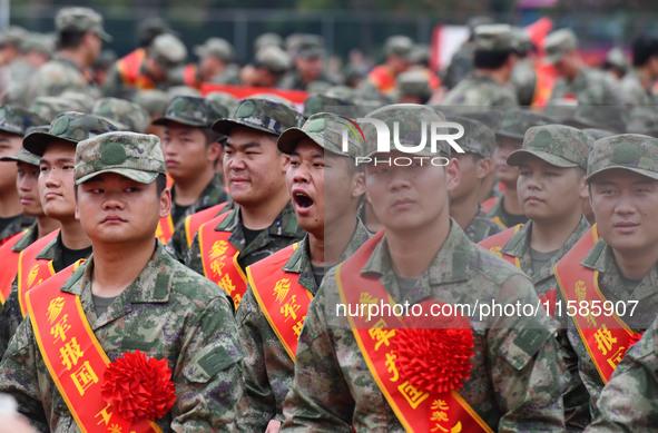 Young conscripts attend a send-off ceremony for new recruits in Fuyang, China, on September 19, 2024. 