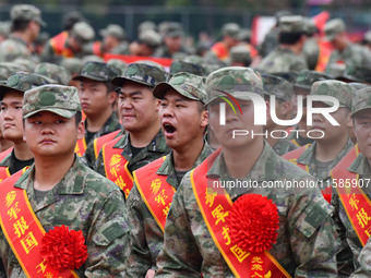 Young conscripts attend a send-off ceremony for new recruits in Fuyang, China, on September 19, 2024. (