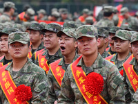 Young conscripts attend a send-off ceremony for new recruits in Fuyang, China, on September 19, 2024. (