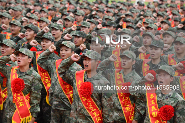 Young conscripts attend a send-off ceremony for new recruits in Fuyang, China, on September 19, 2024. 