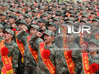 Young conscripts attend a send-off ceremony for new recruits in Fuyang, China, on September 19, 2024. (