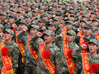 Young conscripts attend a send-off ceremony for new recruits in Fuyang, China, on September 19, 2024. (