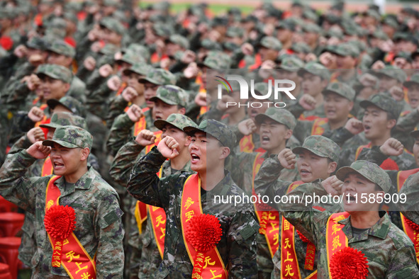 Young conscripts attend a send-off ceremony for new recruits in Fuyang, China, on September 19, 2024. 