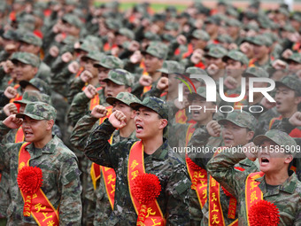 Young conscripts attend a send-off ceremony for new recruits in Fuyang, China, on September 19, 2024. (