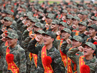 Young conscripts attend a send-off ceremony for new recruits in Fuyang, China, on September 19, 2024. (