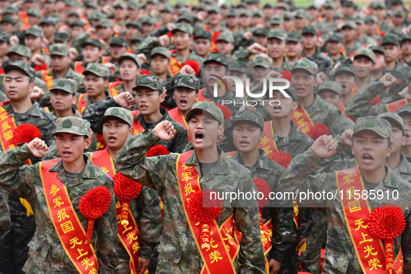 Young conscripts attend a send-off ceremony for new recruits in Fuyang, China, on September 19, 2024. 