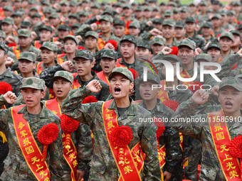 Young conscripts attend a send-off ceremony for new recruits in Fuyang, China, on September 19, 2024. (