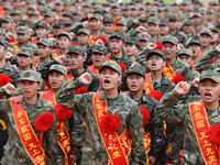 Young conscripts attend a send-off ceremony for new recruits in Fuyang, China, on September 19, 2024. (