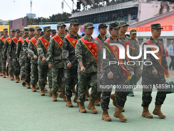 Young conscripts attend a send-off ceremony for new recruits in Fuyang, China, on September 19, 2024. (