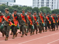 Young conscripts attend a send-off ceremony for new recruits in Fuyang, China, on September 19, 2024. (