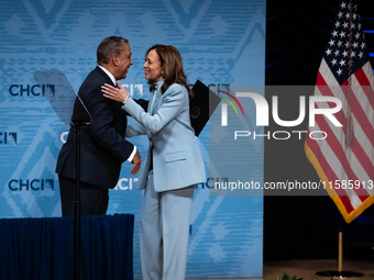 Rep. Adriano Espaillat (D-NY) hugs Vice President and Democratic presidential nominee Kamala Harris after introducing her to deliver remarks...