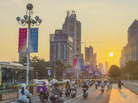 People walk past a sign for the ASEAN Expo in Nanning, China, on September 18, 2024. (