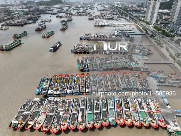 A large number of fishing boats moor at Shenjiamen Fishing Port to take shelter from Typhoon Pulasan in Zhoushan, China, on September 19, 20...