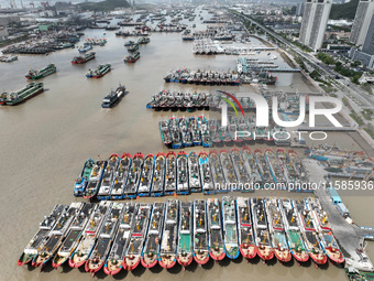 A large number of fishing boats moor at Shenjiamen Fishing Port to take shelter from Typhoon Pulasan in Zhoushan, China, on September 19, 20...