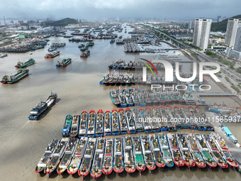 A large number of fishing boats moor at Shenjiamen Fishing Port to take shelter from Typhoon Pulasan in Zhoushan, China, on September 19, 20...