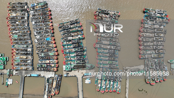 A large number of fishing boats moor at Shenjiamen Fishing Port to take shelter from Typhoon Pulasan in Zhoushan, China, on September 19, 20...