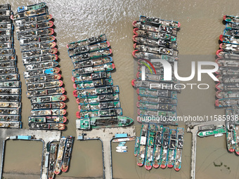 A large number of fishing boats moor at Shenjiamen Fishing Port to take shelter from Typhoon Pulasan in Zhoushan, China, on September 19, 20...