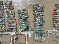 A large number of fishing boats moor at Shenjiamen Fishing Port to take shelter from Typhoon Pulasan in Zhoushan, China, on September 19, 20...