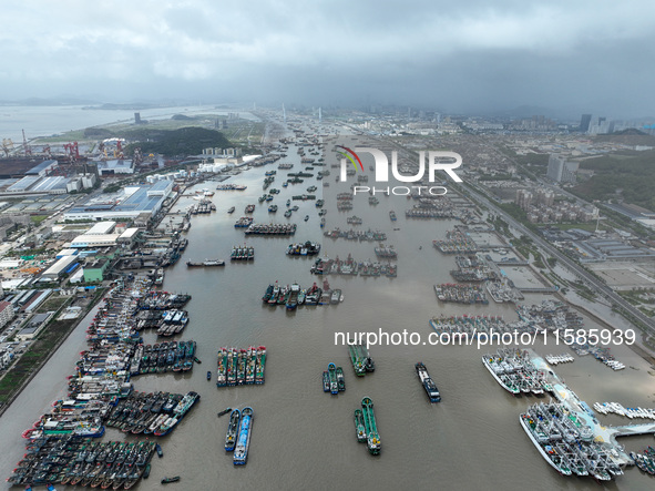 A large number of fishing boats moor at Shenjiamen Fishing Port to take shelter from Typhoon Pulasan in Zhoushan, China, on September 19, 20...