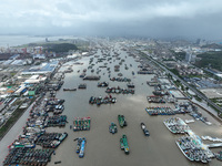 A large number of fishing boats moor at Shenjiamen Fishing Port to take shelter from Typhoon Pulasan in Zhoushan, China, on September 19, 20...