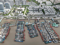 A large number of fishing boats moor at Shenjiamen Fishing Port to take shelter from Typhoon Pulasan in Zhoushan, China, on September 19, 20...