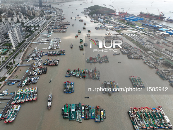 A large number of fishing boats moor at Shenjiamen Fishing Port to take shelter from Typhoon Pulasan in Zhoushan, China, on September 19, 20...