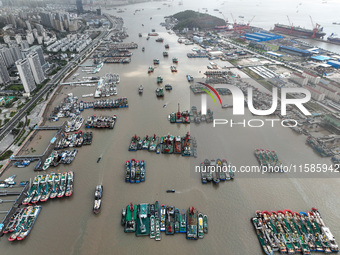 A large number of fishing boats moor at Shenjiamen Fishing Port to take shelter from Typhoon Pulasan in Zhoushan, China, on September 19, 20...