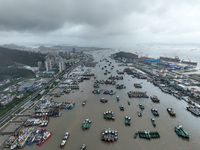 A large number of fishing boats moor at Shenjiamen Fishing Port to take shelter from Typhoon Pulasan in Zhoushan, China, on September 19, 20...