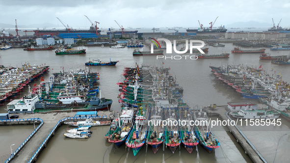 A large number of fishing boats moor at Shenjiamen Fishing Port to take shelter from Typhoon Pulasan in Zhoushan, China, on September 19, 20...